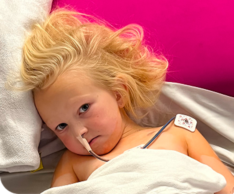 Female patient in hospital bed.