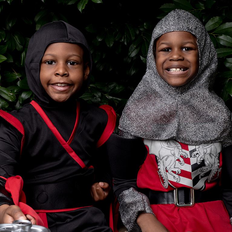 Two boys dressed up like ninjas for Halloween.