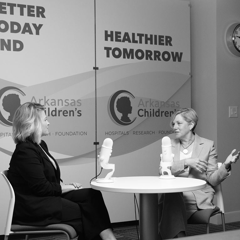 Marcy Doderer sitting during her vodcast interview.