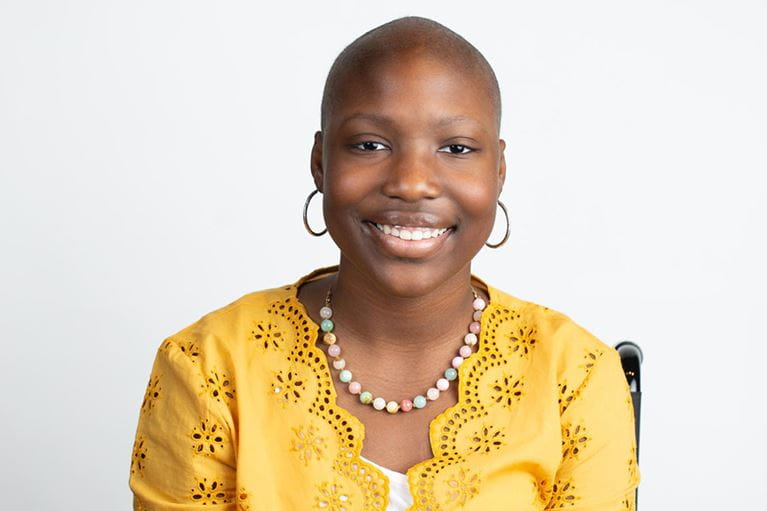Young cancer patient wearing gold shirt