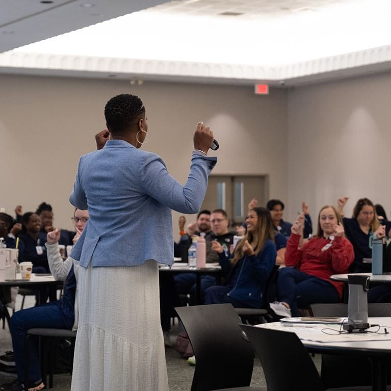 Nursing leader speaking at training event.