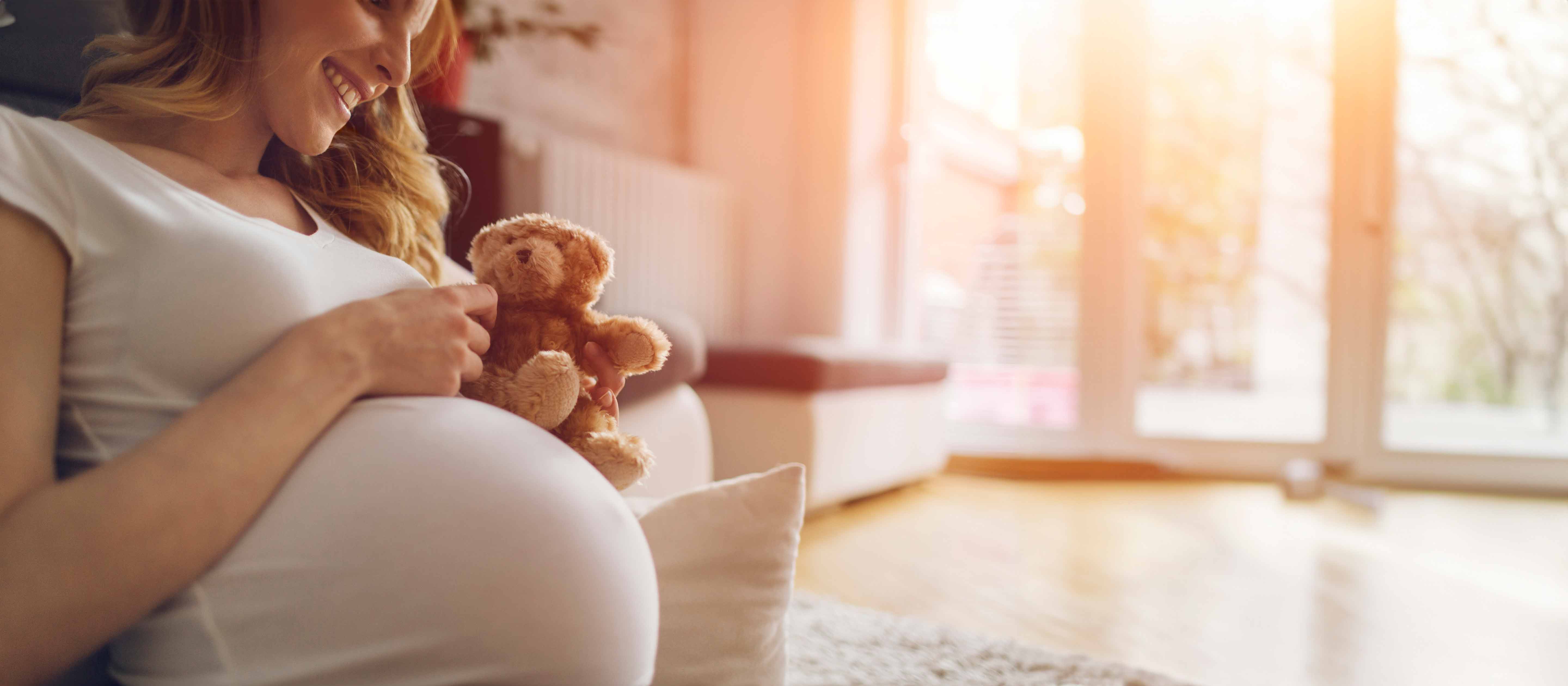 Pregnant mom with teddy bear