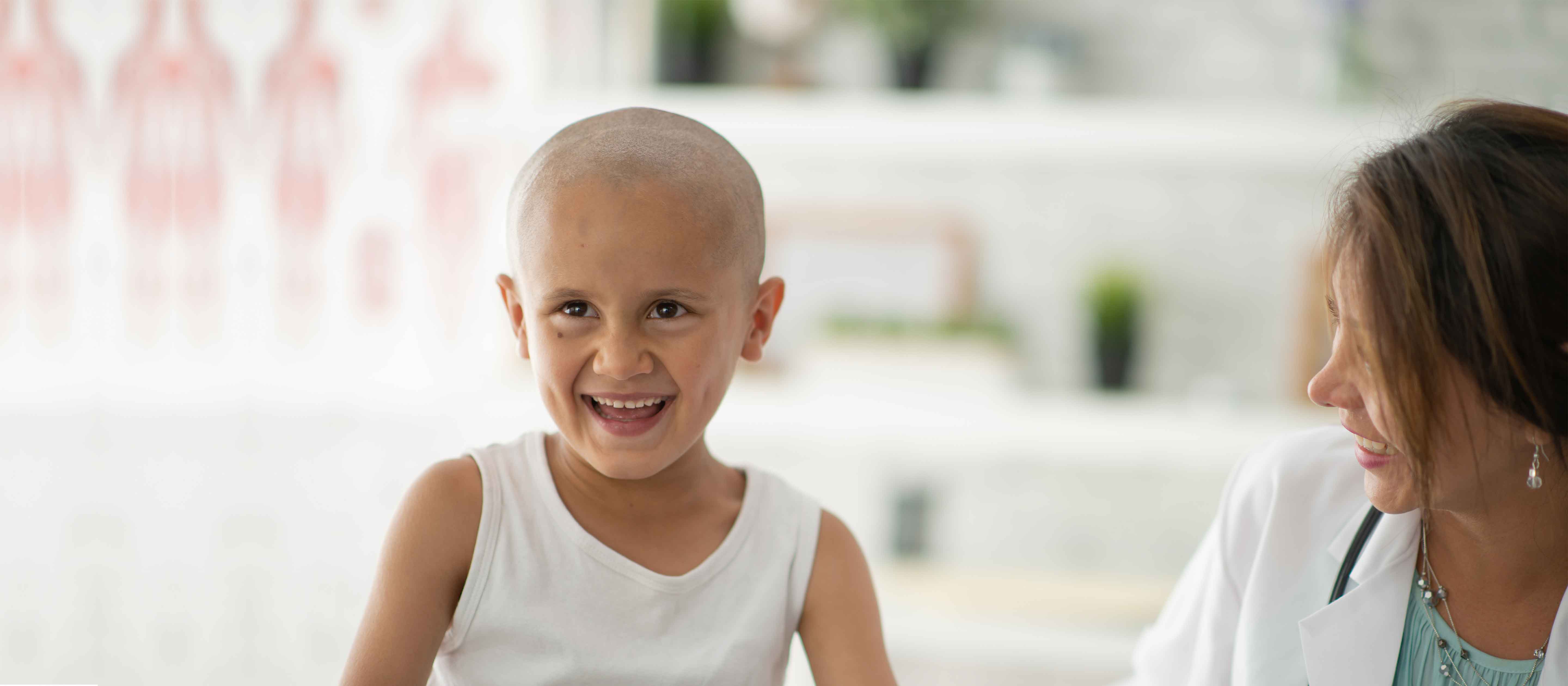 Child smiling while with doctor