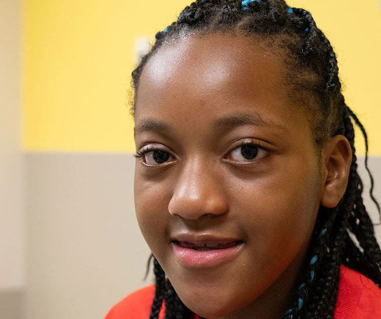 Teenage girl with red shirt in pulmonary clinic. 