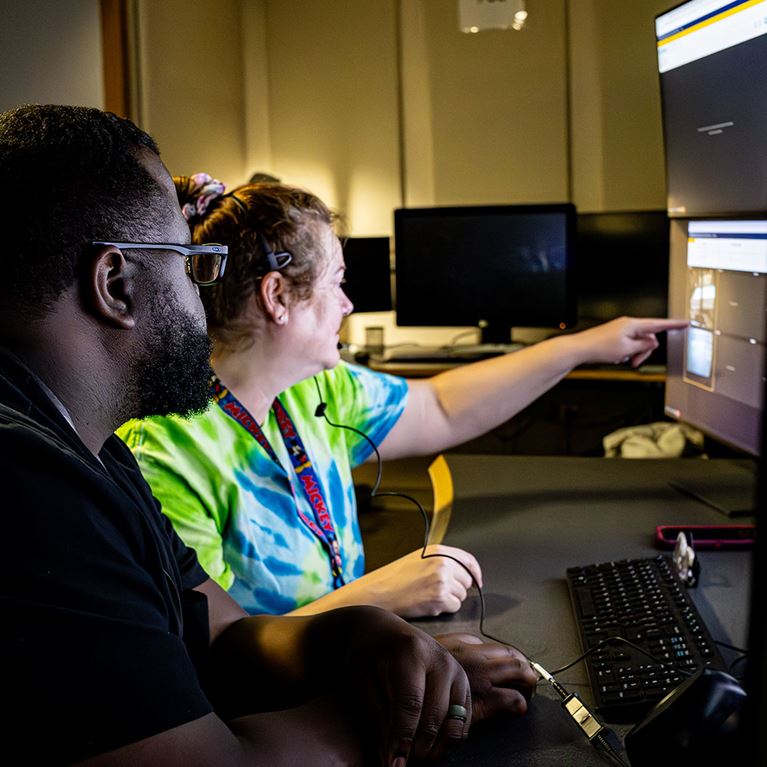 Radiology department employees reviewing images.