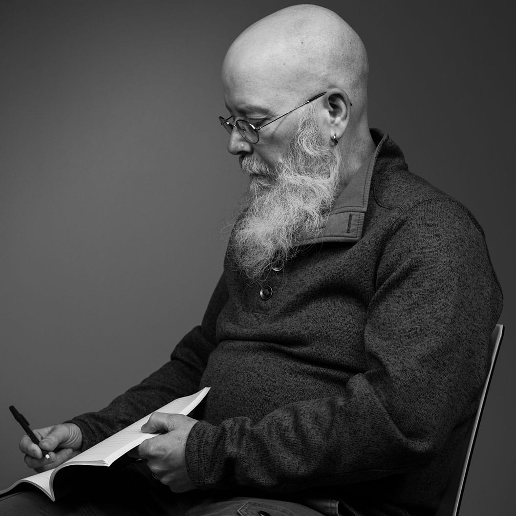 Chester Harper writing in studio.