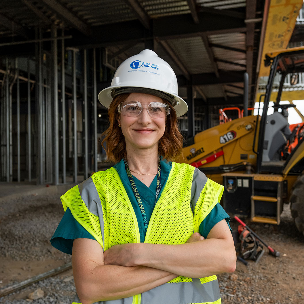Dr. Dotson standing in construction zone wearing hard hat.
