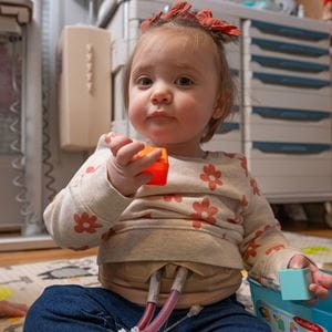 Toddler girl with blonde pigtails.