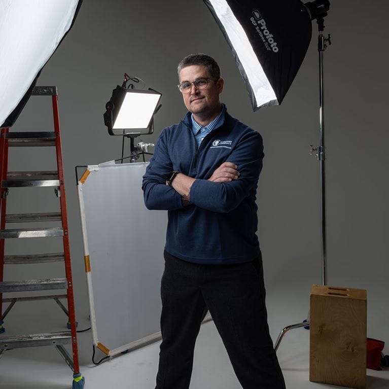 John David Pittman posing in photography studio.