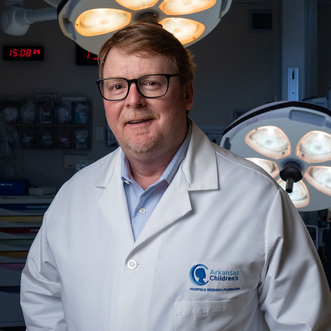 Dr. Todd Maxson wearing white coat.