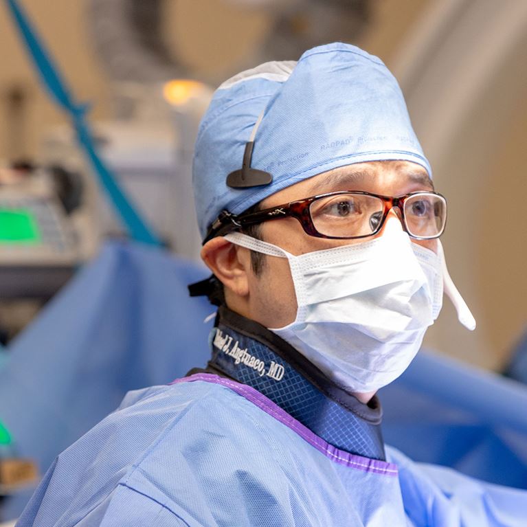 Photo of cardiac surgeon in operating room.