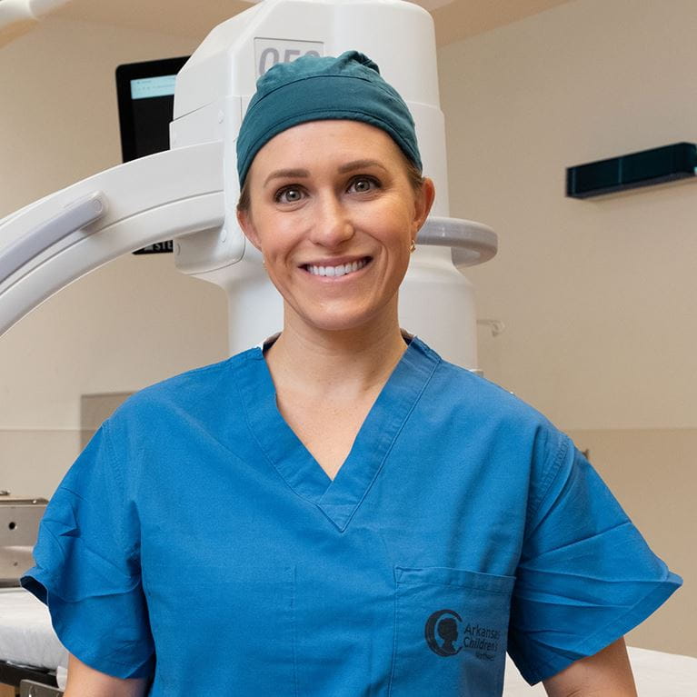 Dr. Koder wearing blue scrubs.