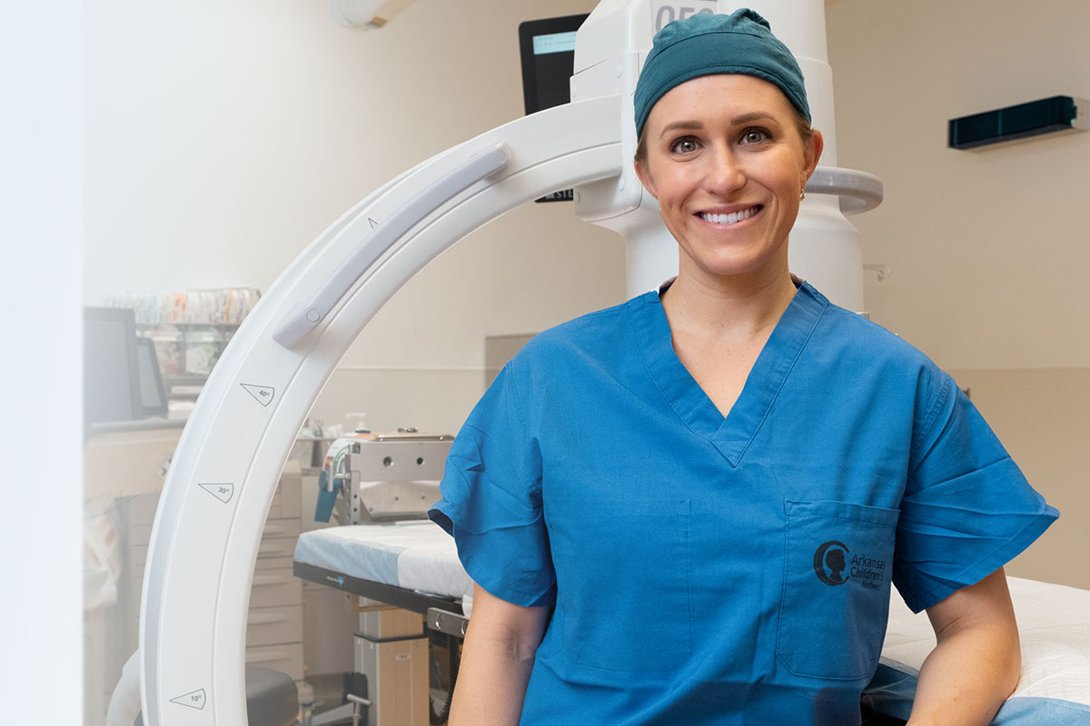 Female doctor wearing scrubs.