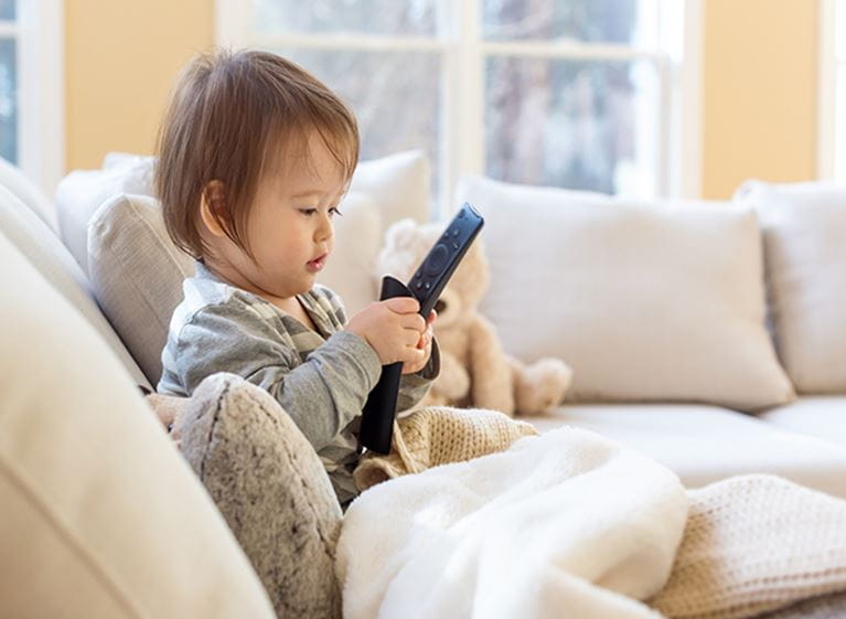 Child playing with electronic toy