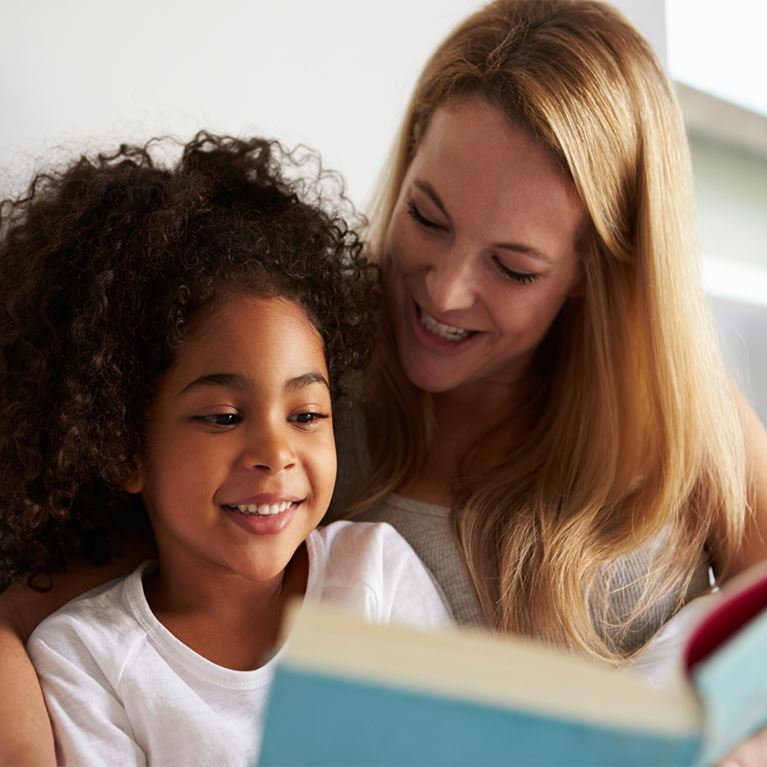 Mom reading to child. 