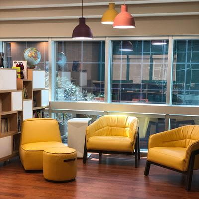 Three yellow chairs in the hospital classroom
