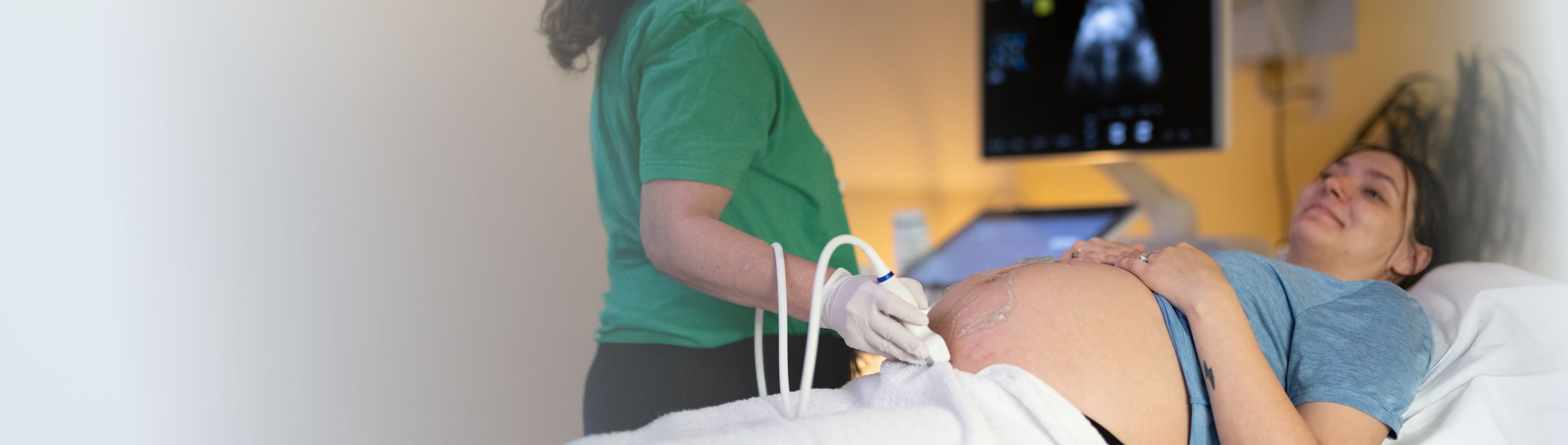 Parent getting a fetal echo scan.