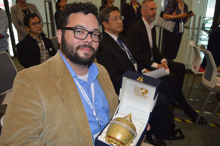 Photo of Joe Schaffner holding safety award