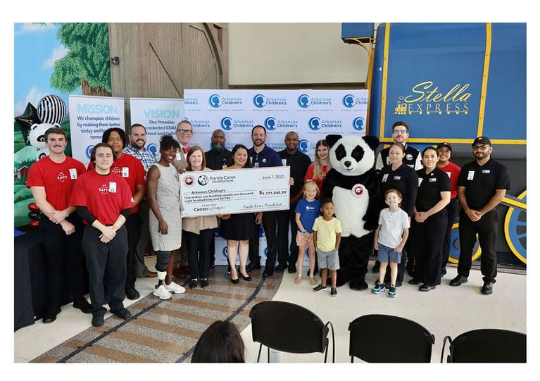 Group of people at Arkansas Children's accepting a donation check from Panda Express.