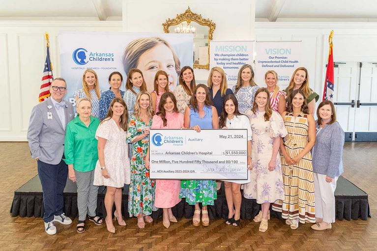Group of people with a check presentation
