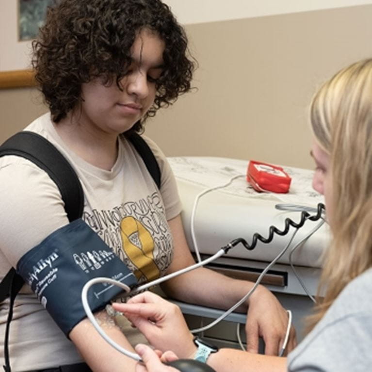 AC Patient, Mackenzie, with clinician.