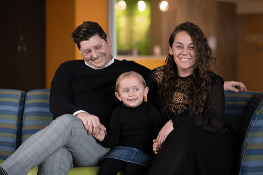 Family wearing black shirts.