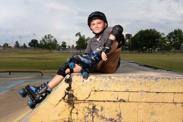 ACH patient, Aiden Jandebeur, wearing skating gear