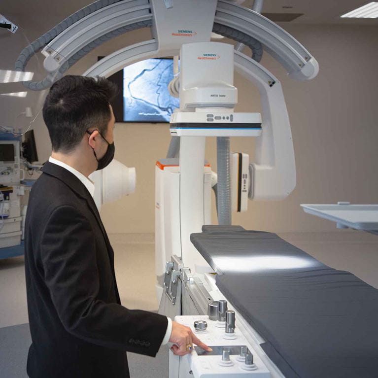 Doctor wearing mask in cath lab